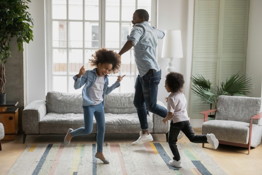 Father and daughters playing