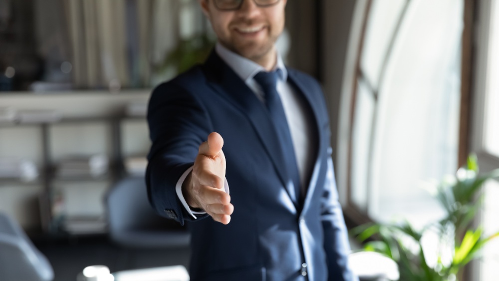 Recruiter attempting to shake hands