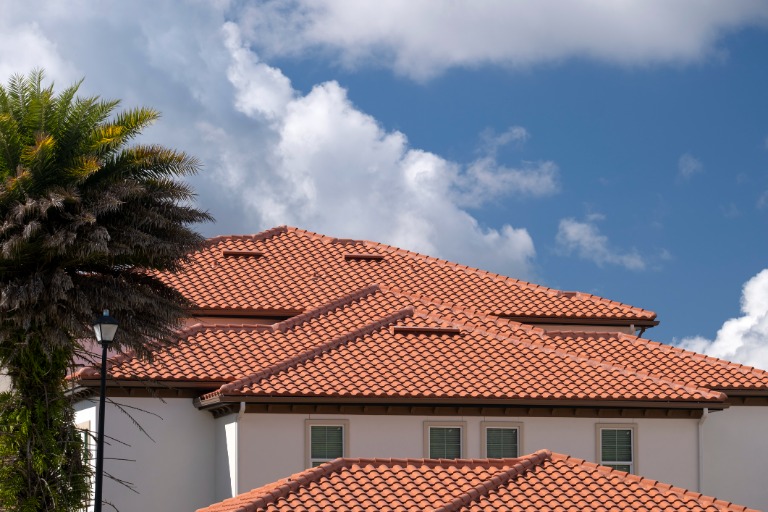 house rooftop covered with ceramic shingles