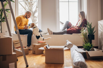 Couple with pet dog in new home